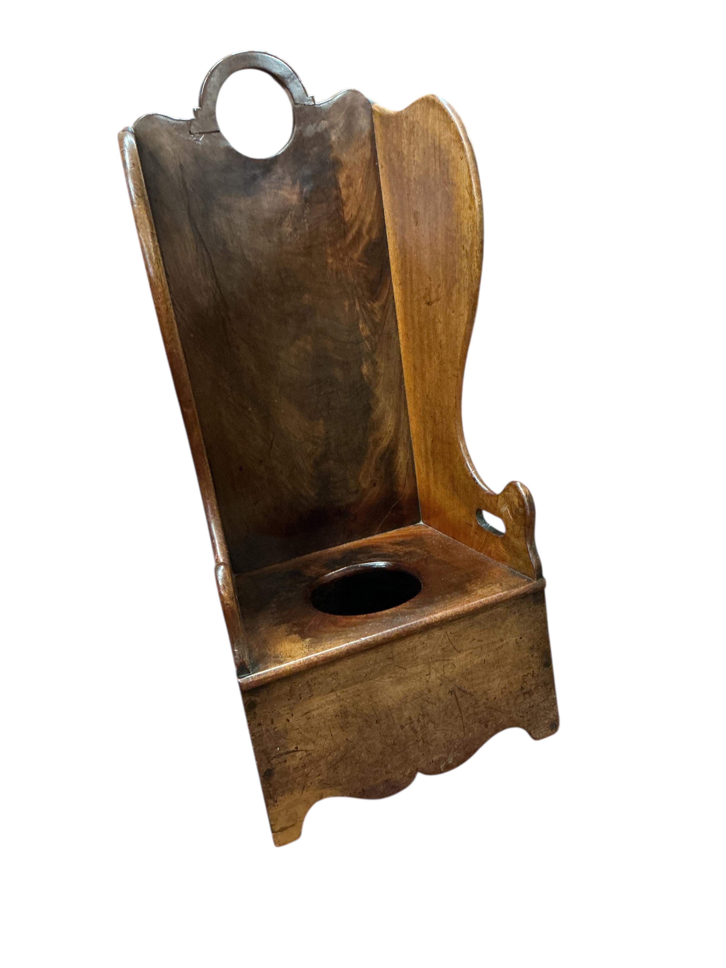 A Victorian mahogany child's rocking lambing commode chair, height 71cm and two later primitive style child’s chairs